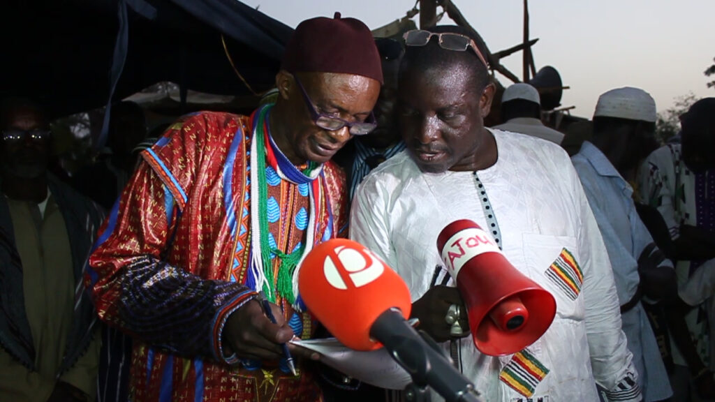 CEO Momodou Turo Darboe and Mr. Saikou Fofana comparing notes in order to give the much needed funds to groups identified to receive assistance