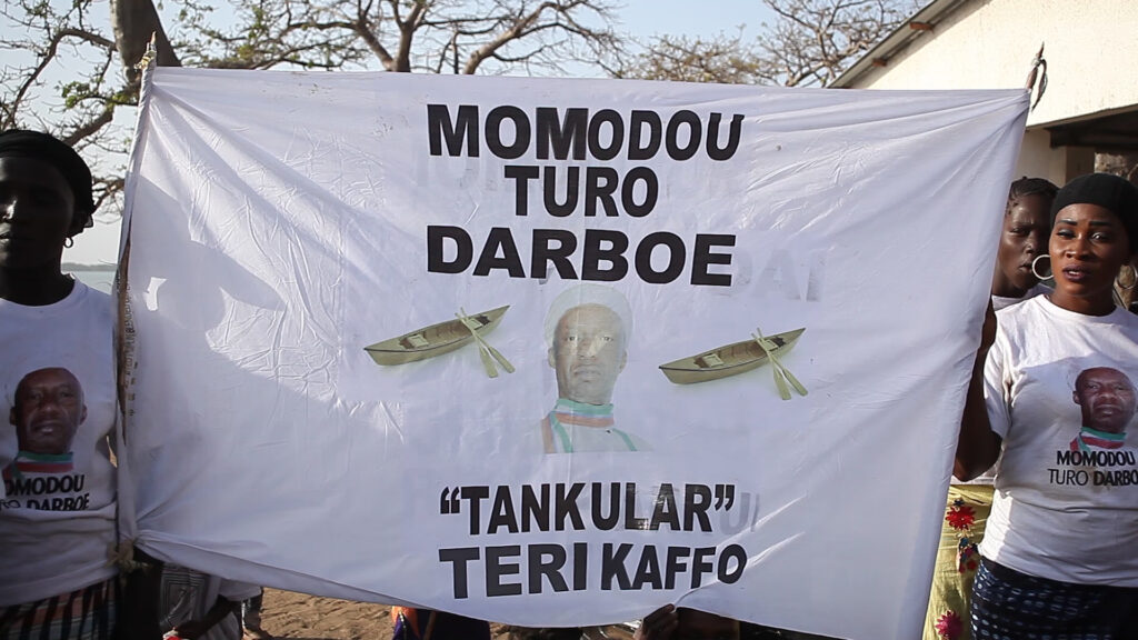 Local fishmongers displaying name of their Kafo group in appreciation of support from the VDF 1