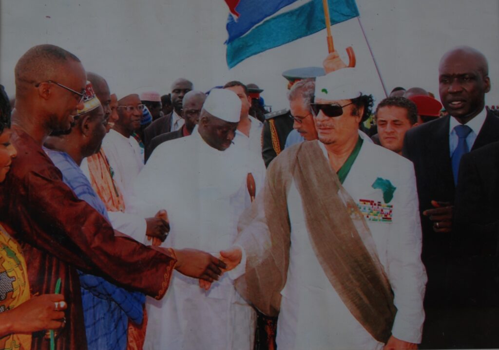 With Moammar al Gaddafi of Libya