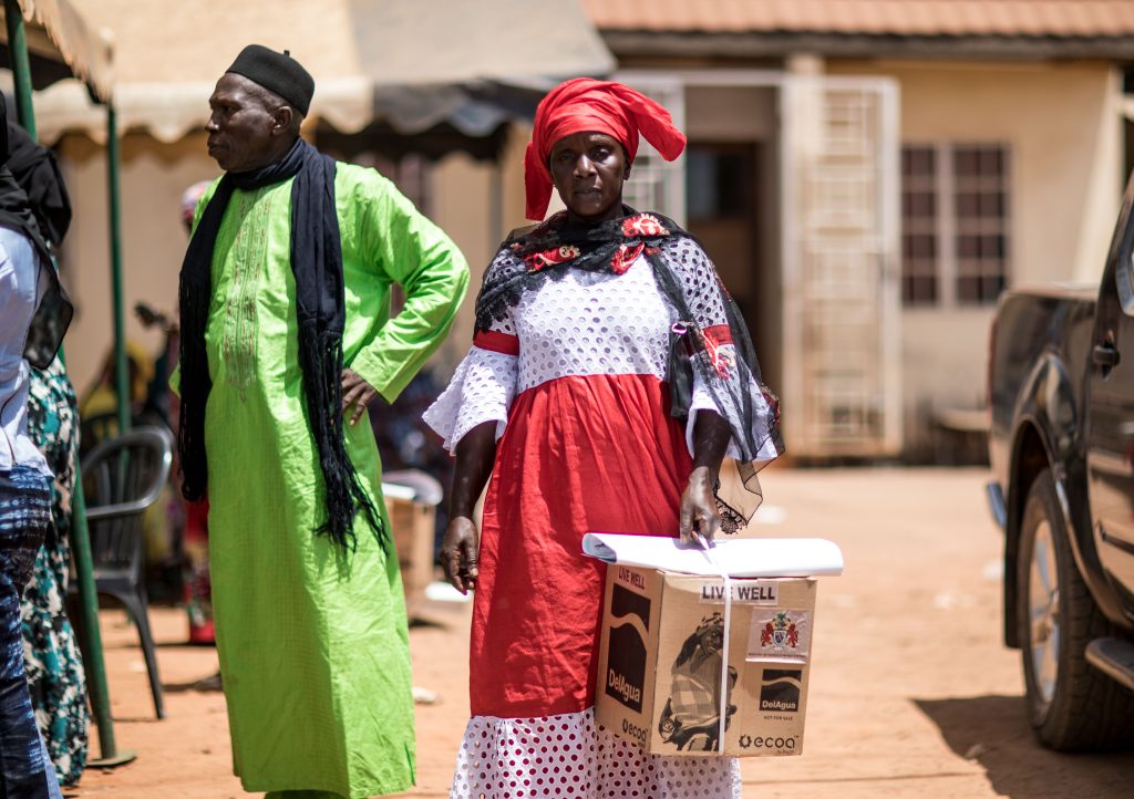 Beneficiary walks away with a stove