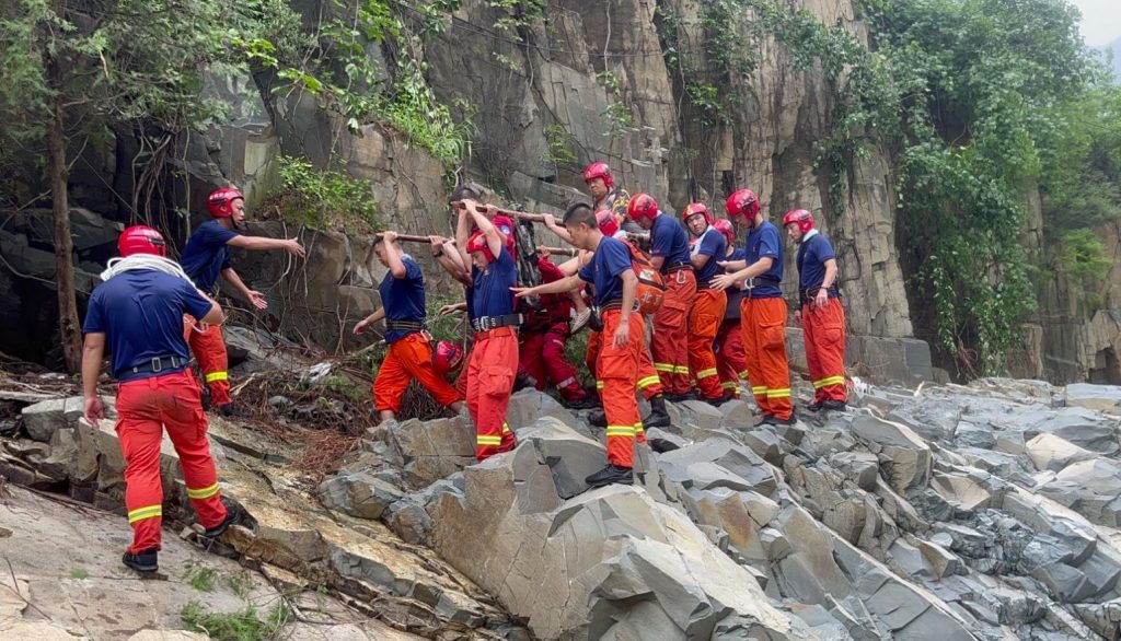 Rescue workers helping villagers in Mentougou