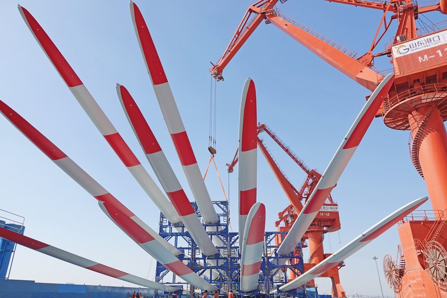 This photo taken on March 2 2023 shows wind power blades to be exported at Yantai Port in Yantai east Chinas Shandong Province