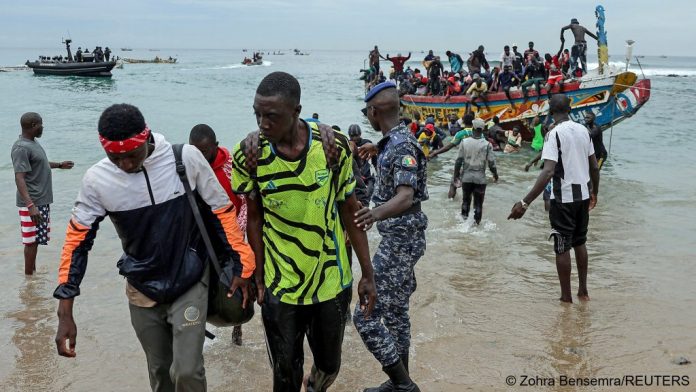 Migrants disembark from their boat in Dakar after being intercepted by Senegalese marine officials on September 16, 2025 _ Photo- REUTERS_Zohra Bensemra